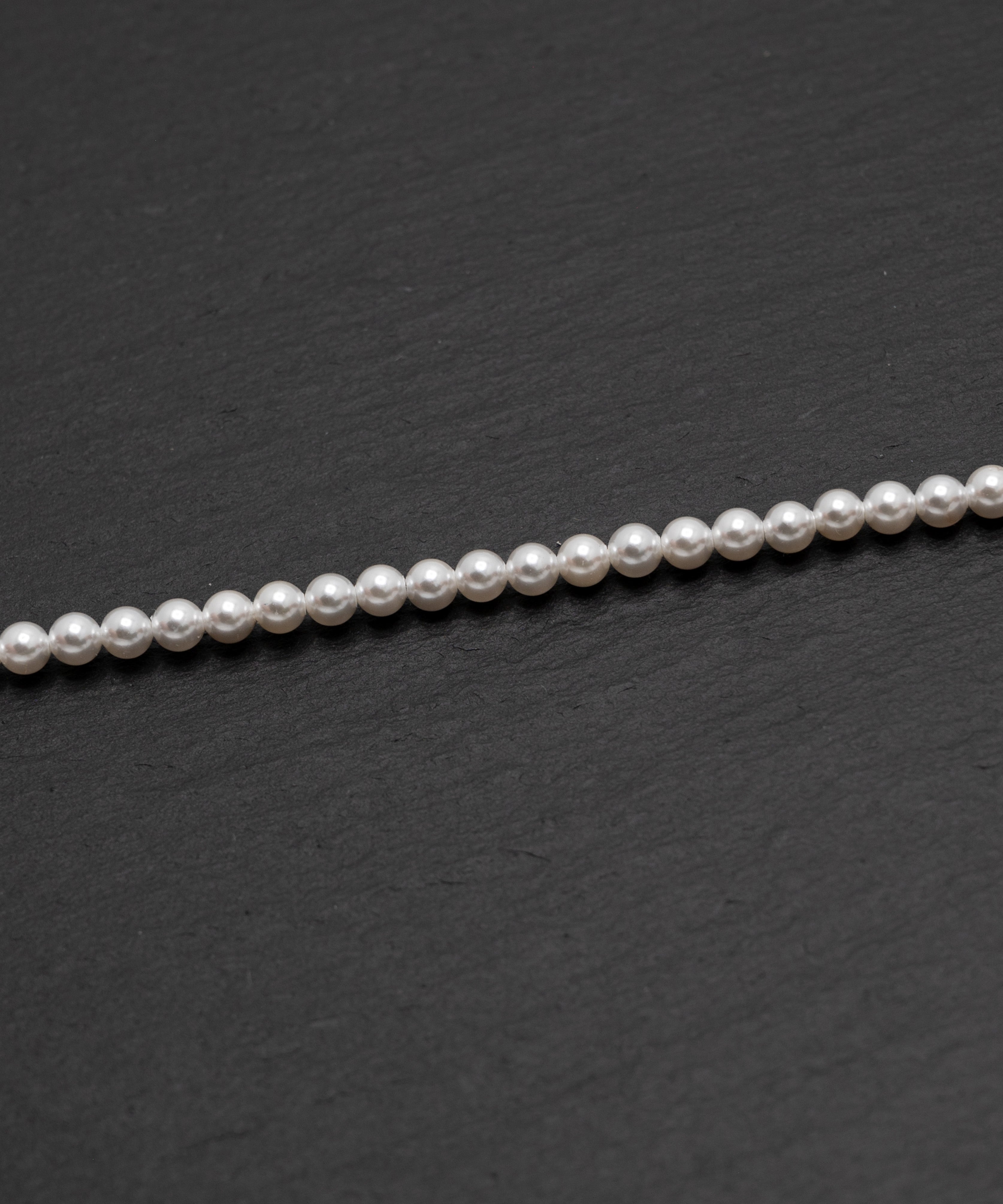 Close-up detail of pearl chain necklace with silver lobster clasp, 40 cm with an extra 5 cm adjustable length