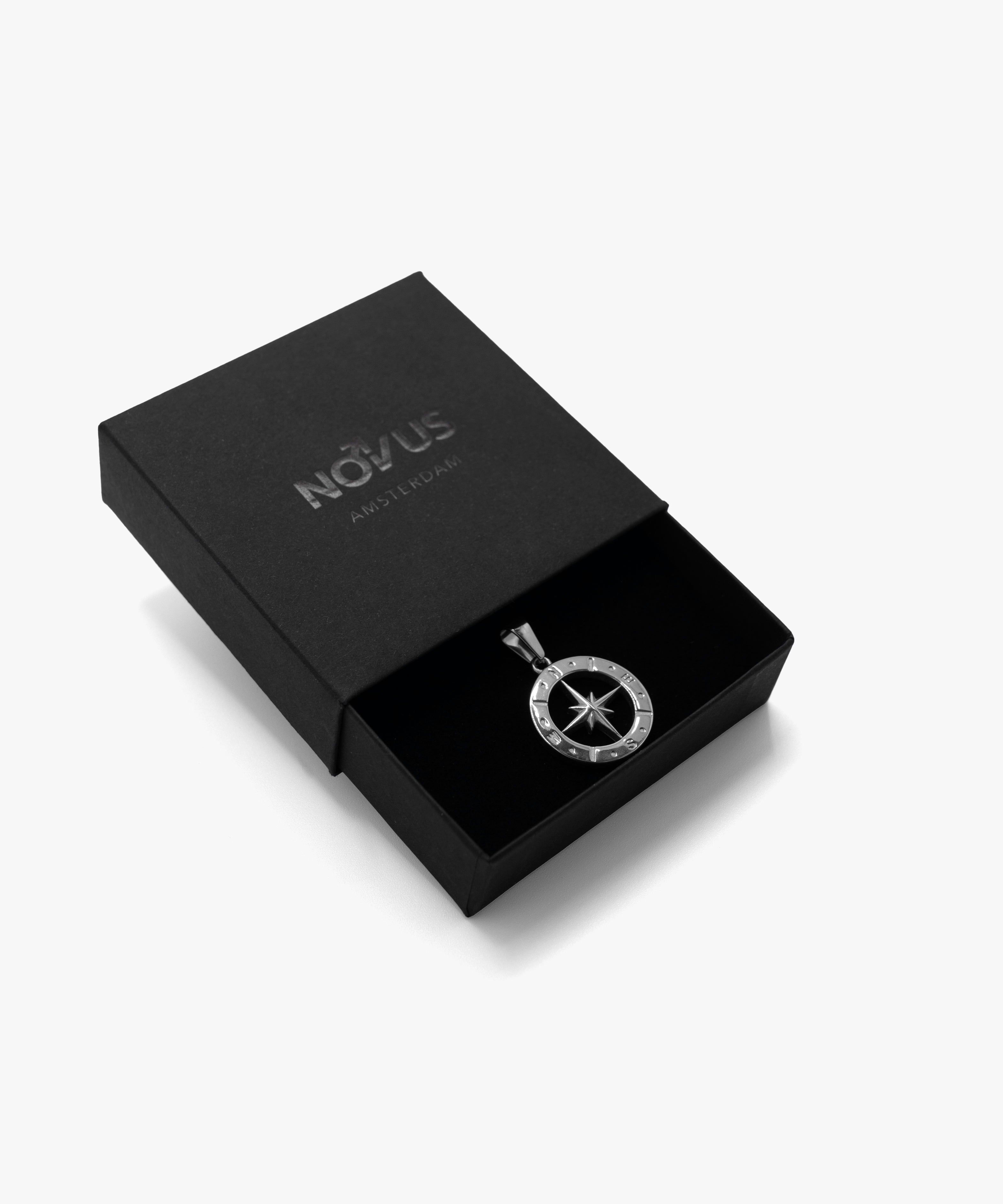 Silver half compass pendant with jewelry box, from NOVUS Amsterdam