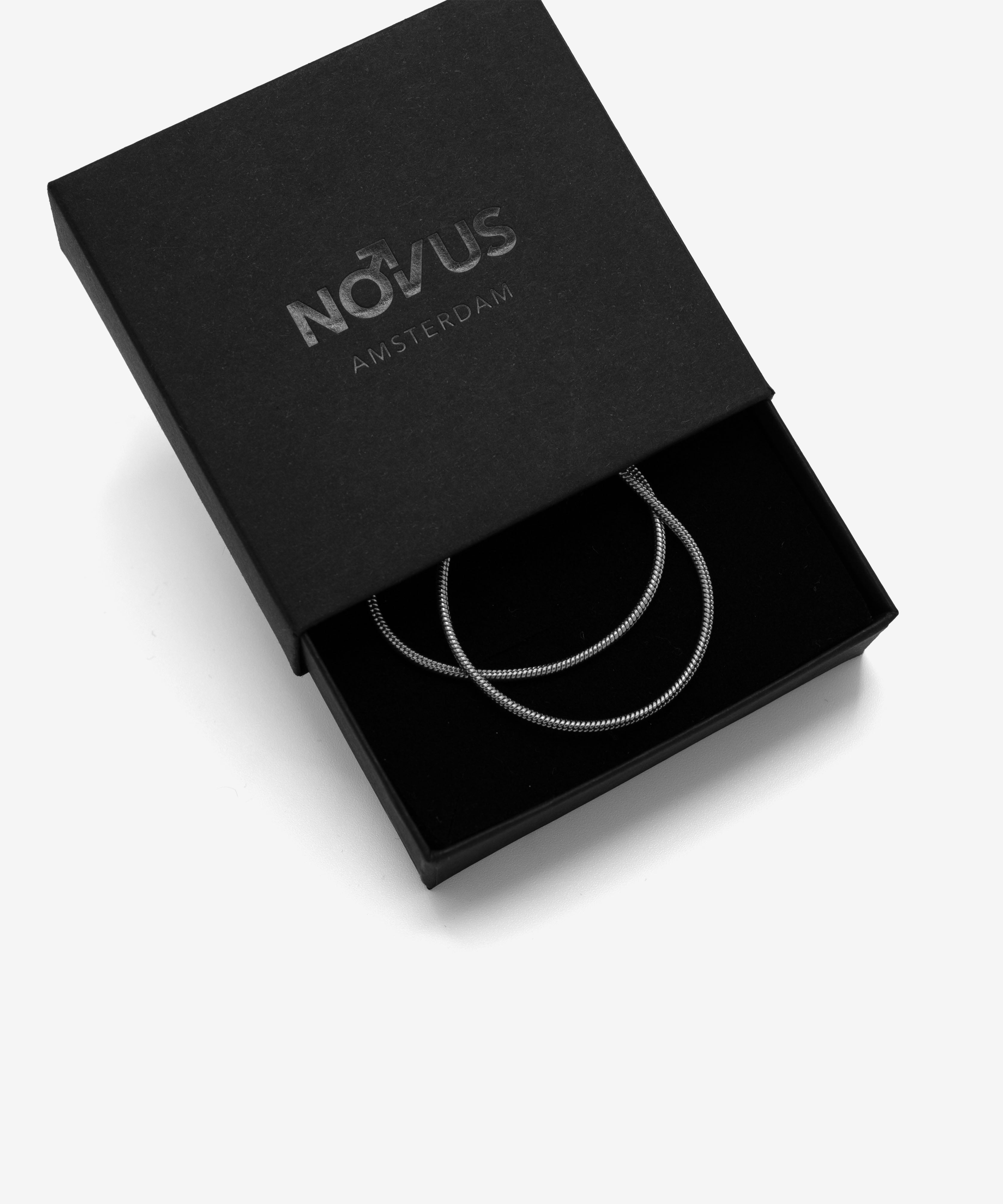 Silver snake chain necklace with lobster clasp in jewelry box, 1.5 mm width, from NOVUS Amsterdam